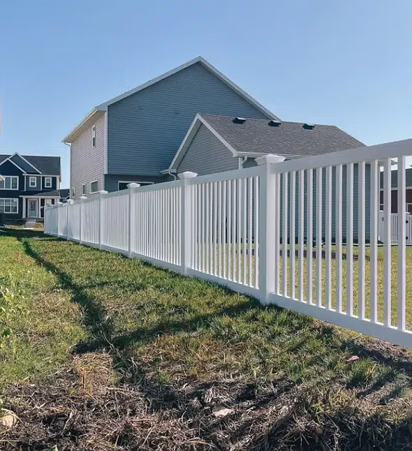 White vinyl fence — front yard